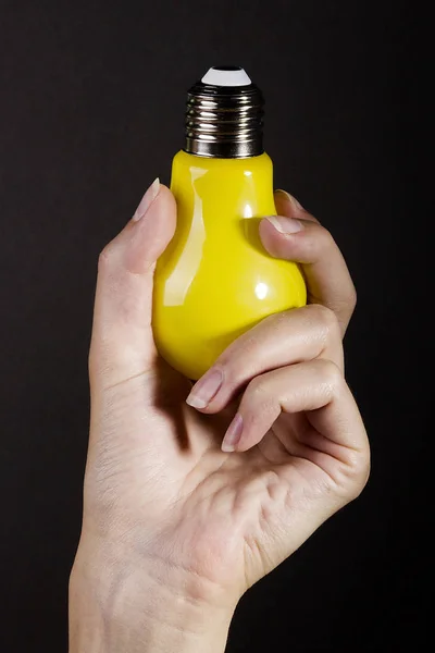 Hand with light bulb — Stock Photo, Image