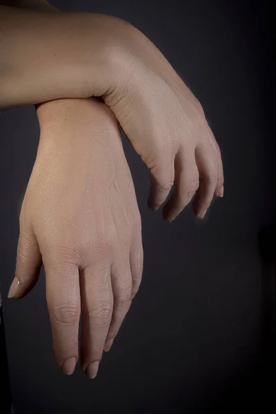 Folded female hands