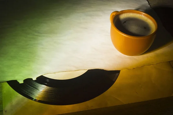 Vinyl record and a cup of coffee — Stock Photo, Image