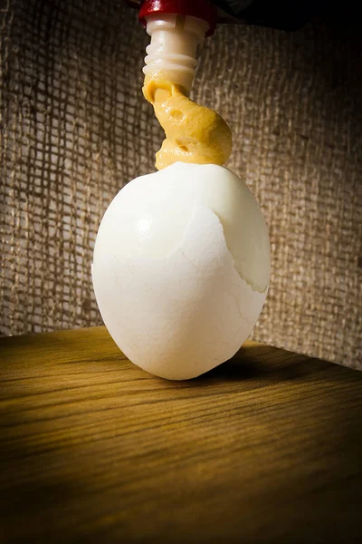 Boiled egg with mustard — Stock Photo, Image