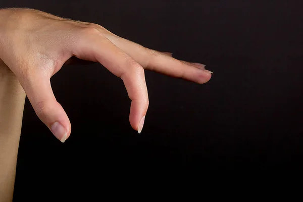 Female Hand Grab Some Item Black Isolated Background — Stock Photo, Image