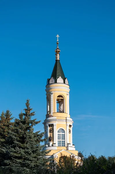 Beautiful orthodox belfry behind the trees — Stock Photo, Image