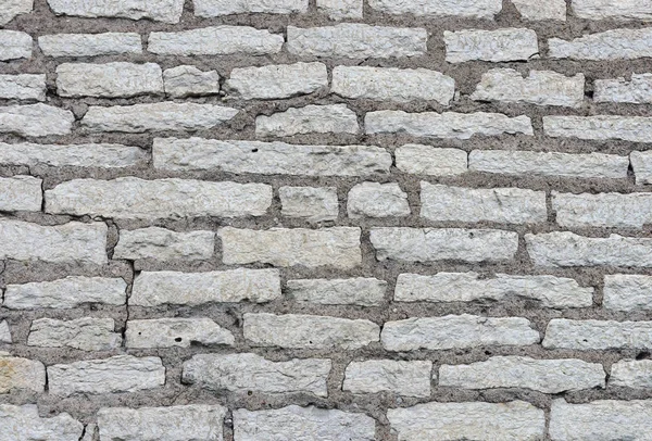 Kalksteen bakstenen muur — Stockfoto