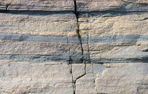 Gelaagde textuur van rotsoppervlak — Stockfoto