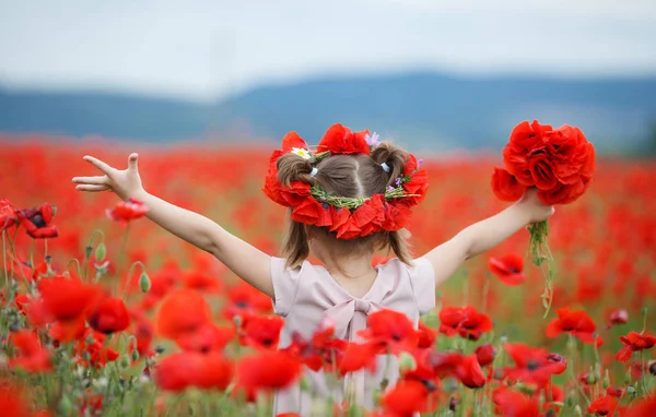 Little Girl Red Wreath Fresh Flowers Walking Poppy Field Sunny — Stock Photo, Image