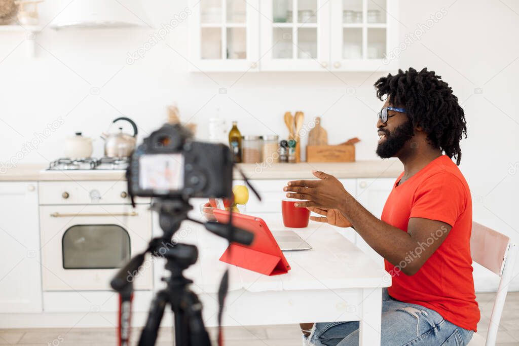 Handsome man recording video business course at home