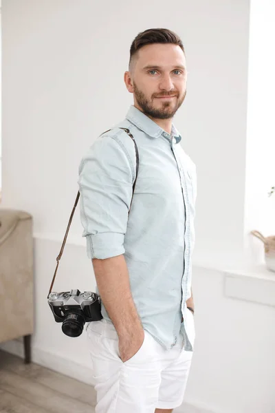 Young man with photo camera — Stock Photo, Image