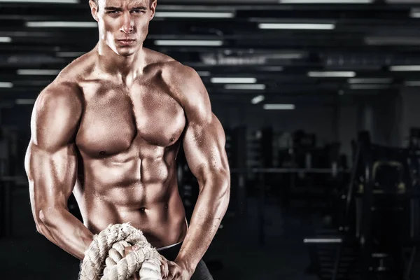 Men with battle rope battle ropes exercise in the fitness crossfit gym. — Stock Photo, Image