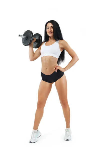 Mujer atleta fitness y culturista sosteniendo mancuerna. Aislado sobre fondo blanco . —  Fotos de Stock