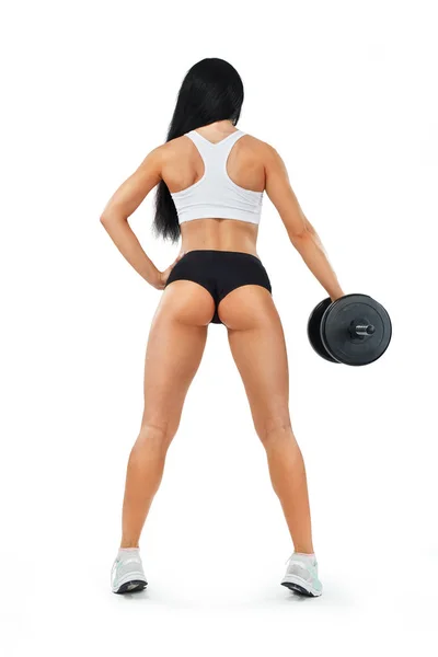 Fitness kvinna idrottare och kroppsbyggare holding hantel. Isolerad på vit bakgrund. — Stockfoto