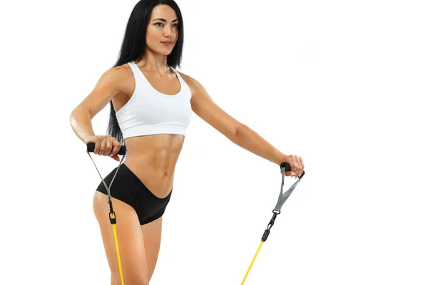 Fitness woman athlete and bodybuilder holding espander. Isolated on white background. — Stock Photo, Image