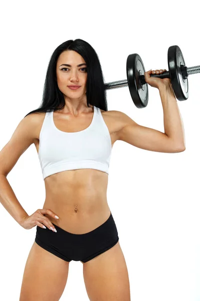 Fitness woman athlete and bodybuilder holding dumbbell . Isolated on white background. — Stock Photo, Image