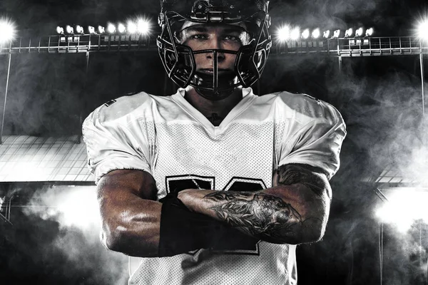 American football sportsman player in helmet on stadium. Sport wallpaper. — Stock Photo, Image