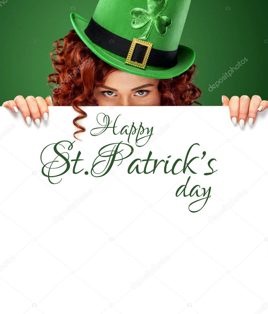 St Patricks Day. Young sexy ginger Oktoberfest waitress on green background with banner for copy space