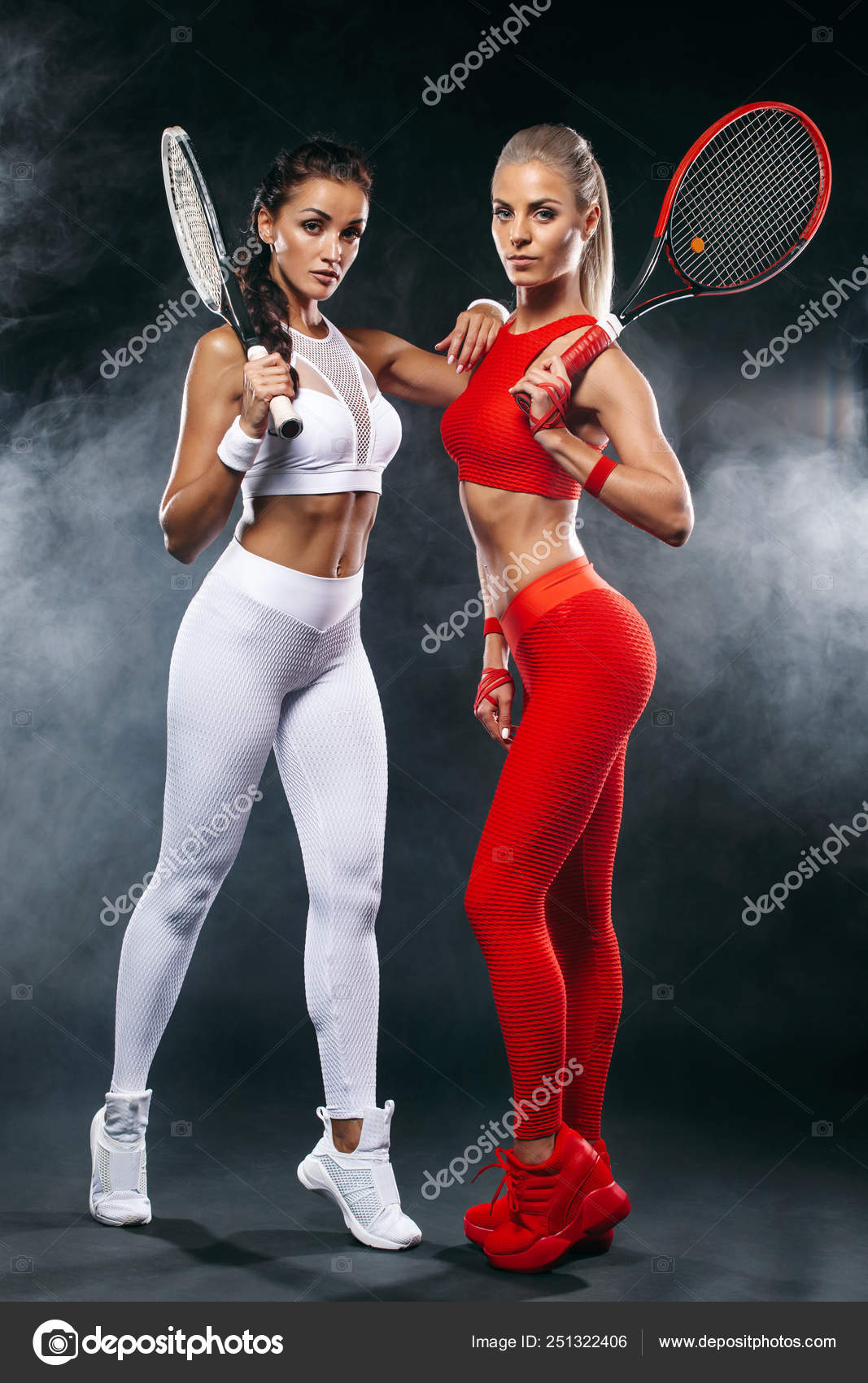 Two women athlete and tennis players on black background. Sport and tennis  concept. — Stock Photo © MikeOrlov #251322406