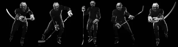 Ice hockey player man in the mask and gloves on black background with stick. — Stock Photo, Image
