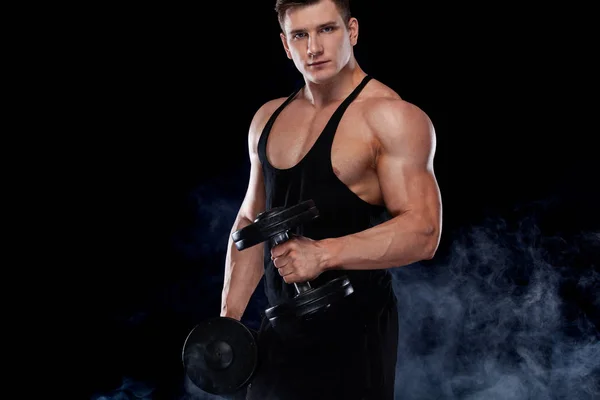 Muscular fitness sports man, atlete with dumbbell in fitness gym. Energy and power. — Stock Photo, Image