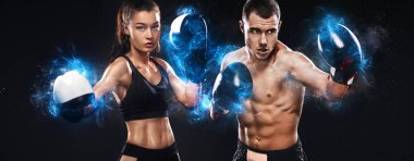 İki sporcu, kadın ve erkek boksörler siyah arka plan üzerinde eldiven mücadele. Boks ve fitness konsepti.