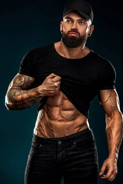 Strong and fit man bodybuilder. Sporty muscular guy athlete. Sport and fitness concept. Mens fashion. — Stock Photo, Image