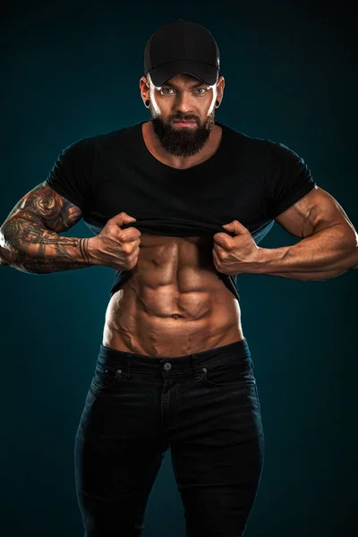 Strong and fit man bodybuilder. Sporty muscular guy athlete. Sport and fitness concept. Mens fashion. — Stock Photo, Image