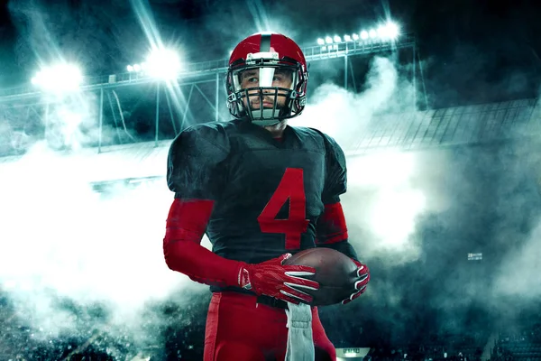Closeup portrait of american football player, athlete sportsman in red helmet on grand arena background. Sport and motivation wallpaper. — Stock Photo, Image