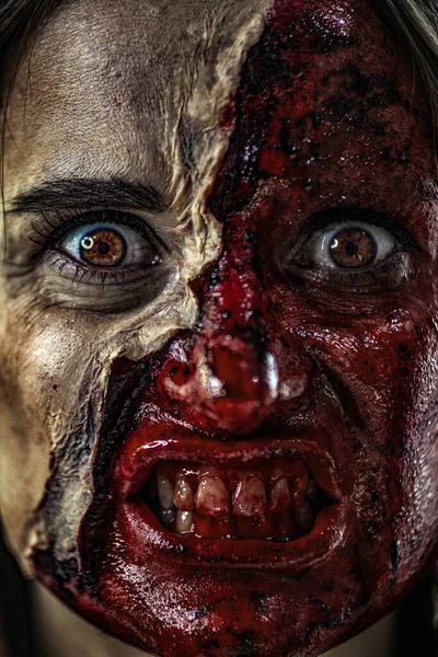 Zombie makeup on Halloween 2020. Creative art make-up for eve of All Saints Day party. Creepy bloody face. Close-up portrait of horrible woman. Horror. — Stock Photo, Image