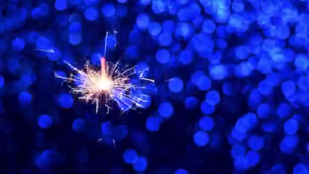 Sparkler and Blue Christmas or New Year background — Stock Video