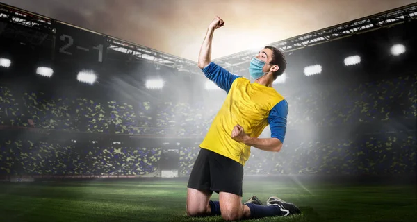 Soccer or football player in mask — Stock Photo, Image