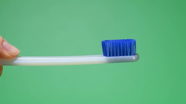 Squeezing tooth paste on toothbrush — Stock Video