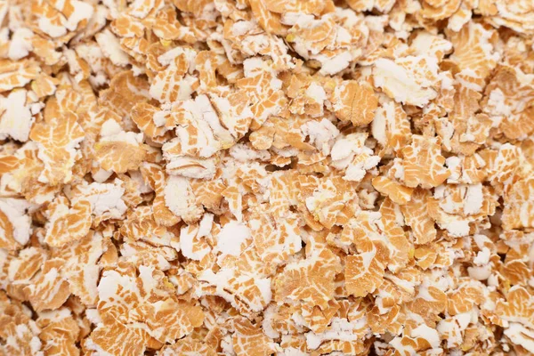 Wheat flakes background. — Stock Photo, Image