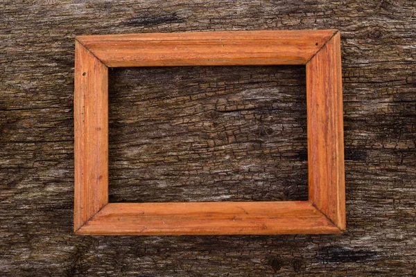 古い木のテーブルの背景の木製フレーム — ストック写真
