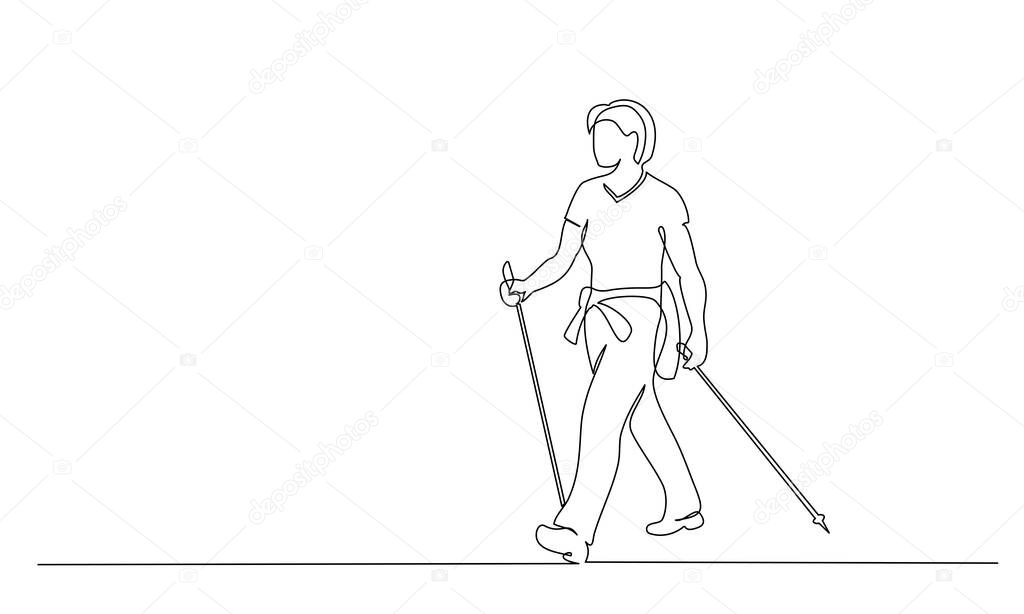 Woman walks on foot with walking sticks. Nordic walking