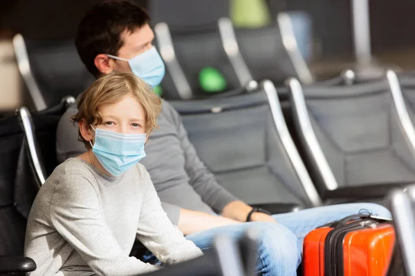 Family Two Father Son Wearing Face Masks Sitting Airport Terminal — Stock Photo, Image