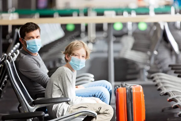 Family Two Father Son Wearing Face Masks Sitting Airport Terminal — Stock Photo, Image