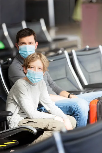 Family Two Father Son Wearing Face Masks Sitting Airport Terminal — Stock Photo, Image