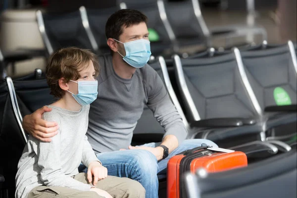 Family Two Father Son Wearing Face Masks Sitting Airport Terminal — Stock Photo, Image