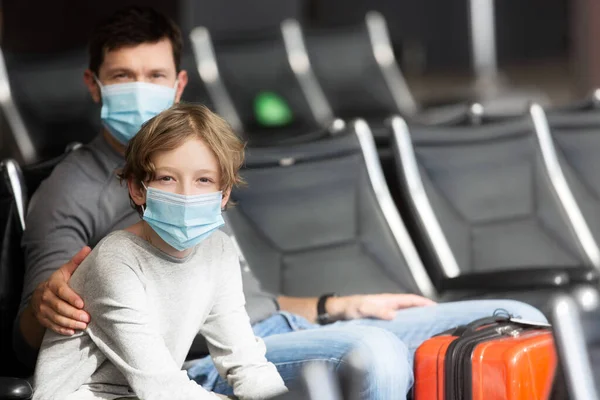 Family Two Father Son Wearing Face Masks Sitting Airport Terminal — Stock Photo, Image