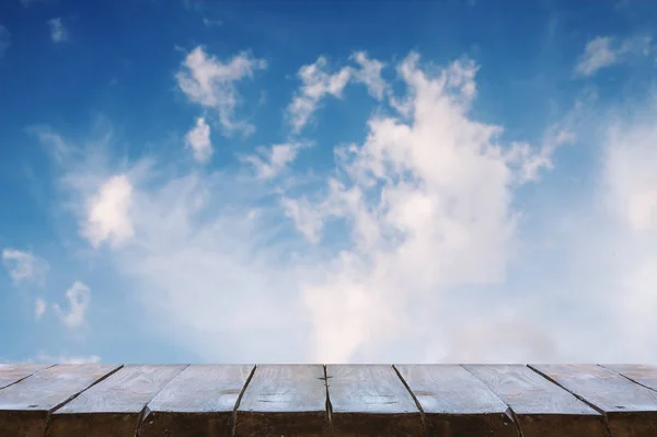 wooden table with sky background