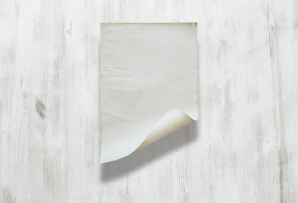 Paper on wooden background — Stock Photo, Image
