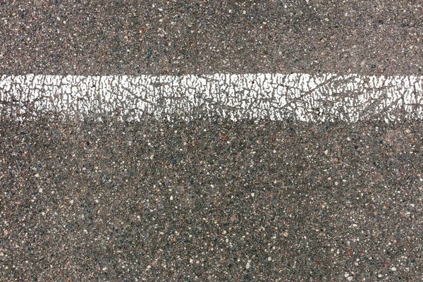 grey asphalt road texture with cracked white dividing line