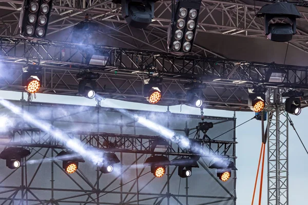 check of lightning equipment before concert. set of spotlights for outdoor stage 