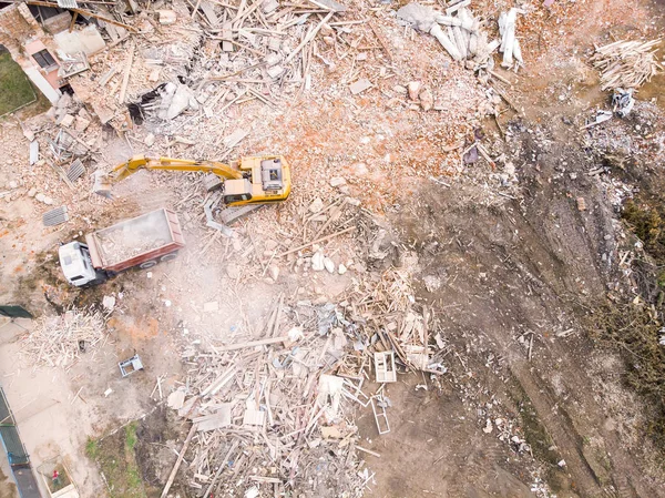 top view of demolition site. destruction of old building. heavy machinery clearing out construction site