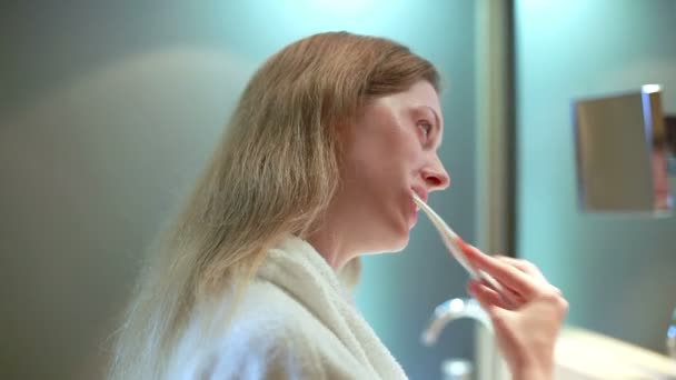 Young Woman Brushing Teeth — Stock Video