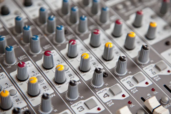 Audio studio sound mixer equalizer board controls, top view closeup