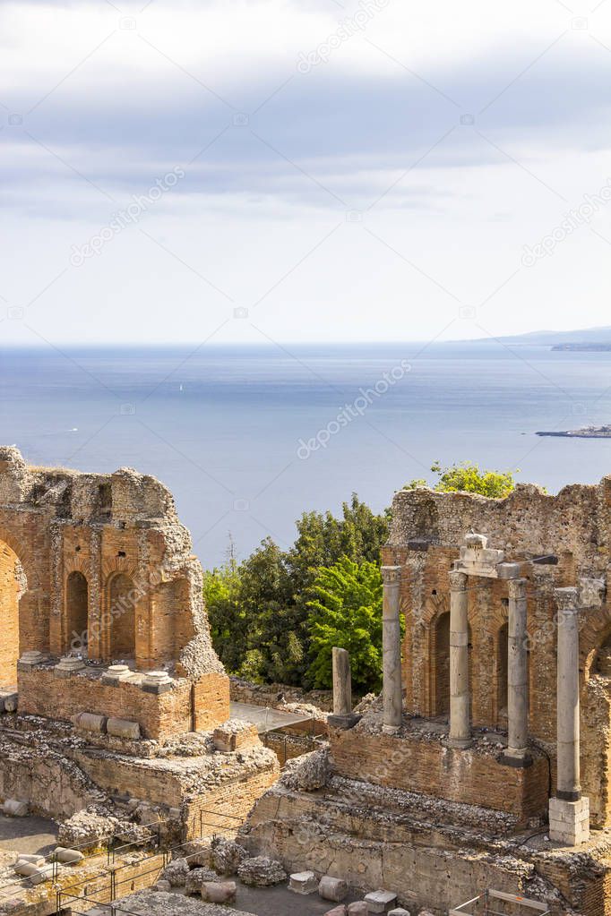 Ruins of ancient Greek Theater (Teatro Greco) and Mediterranean sea, Taormina, Sicily, Italy