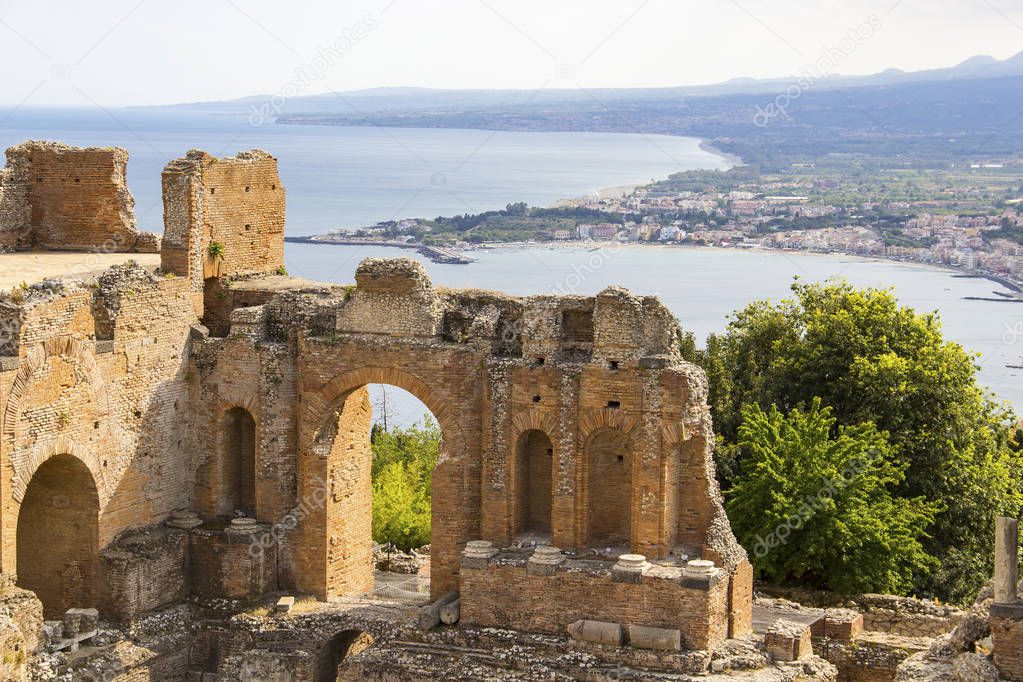 Ruins of ancient Greek Theater (Teatro Greco) and Mediterranean seacoast of Taormina, Sicily, Italy