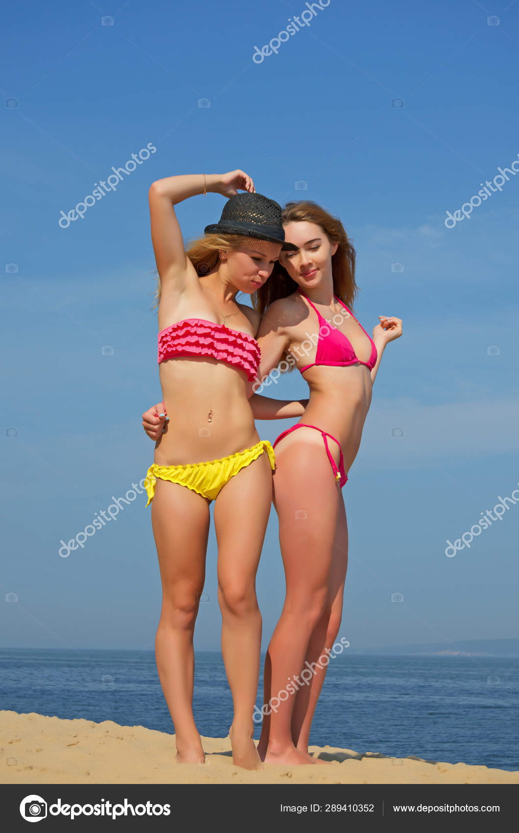 Girls in thongs on the beach. Stock Photo by ©rrraum 289410352