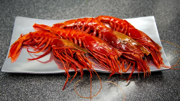 Red big king tiger prawns on silver plate cooked for dinner.