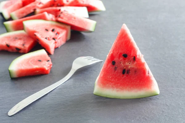 Pieces Juicy Ripe Watermelon Slices Fork Gray Stone Countertop — Stock Photo, Image