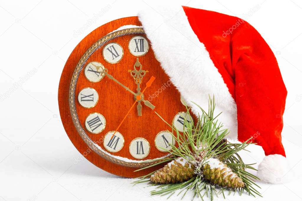 Santa Claus hat, clock and Christmas tree isolated on white background